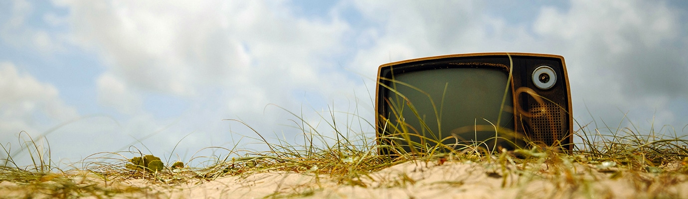 old television set on a dune