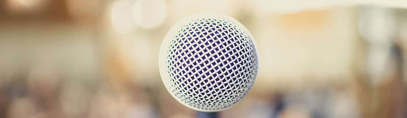 Microphone head in front of a blurred background