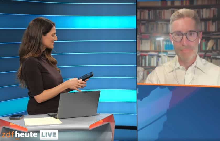 Screenshot aus der Sendung ZDF heute vom 4.9.2026. Im Bild: Moderatorin Alica Jung (links) und Matthias Kettemann (rechts im Bildschirm).